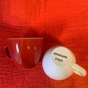 Red and white creature mugs with octopus